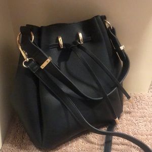Black bucket crossbody purse.